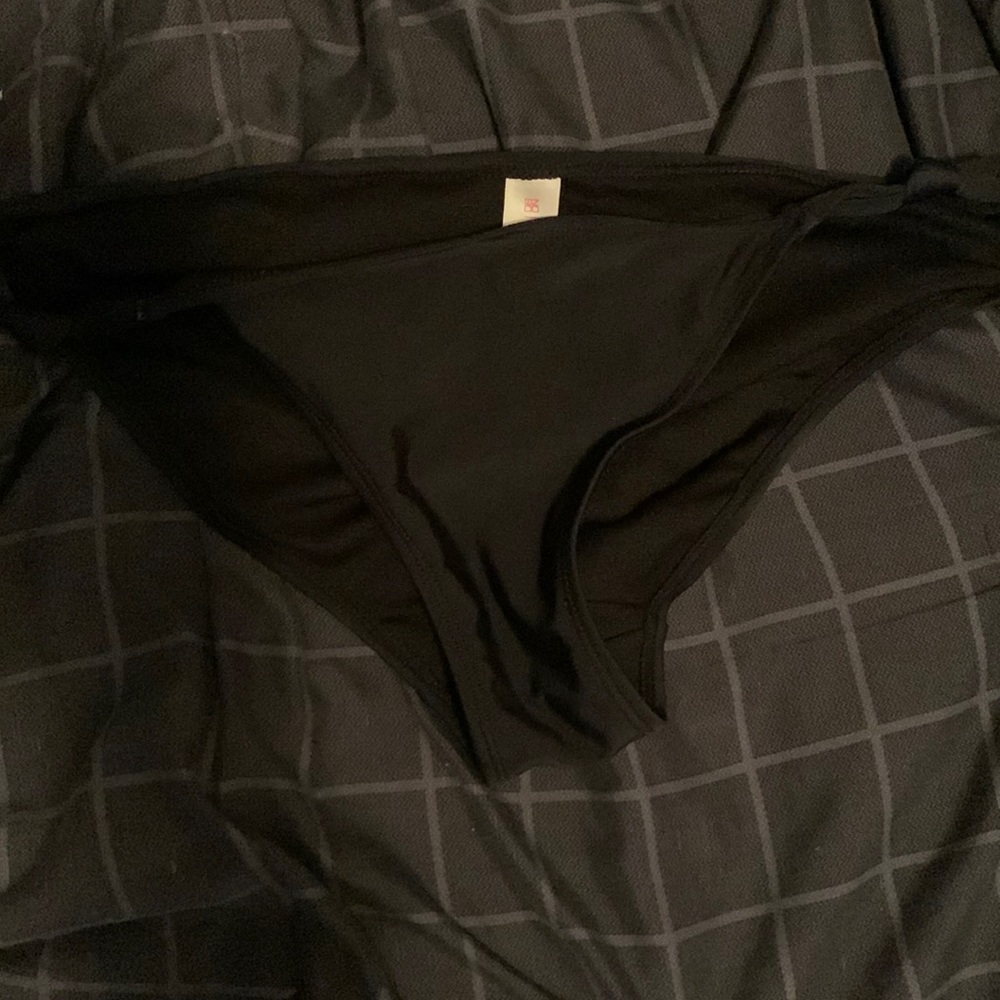 Black bathing suit bottoms. Never been worn, in good condition. Too big on me.